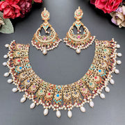 BRIDAL GOLD NECKLACE SET STUDDED WITH NAVRATTAN STONES & CRAFTED USING TRADITIONAL INDIAN ART