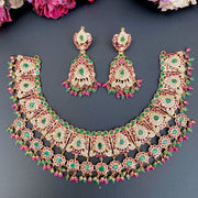 GOLD NECKLACE SET STUDDED WITH PRECIOUS EMERALDS AND RUBIES